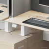 Video showing Modern Sit-to-Stand Office Desk with Integrated Storage and Central Privacy Screens